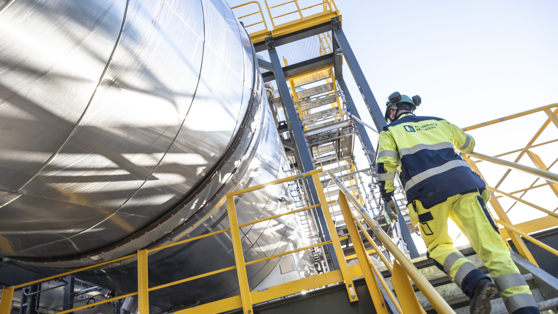 Man walking up the stairs at Brevok CCS plant